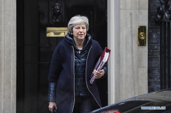 British Prime Minister Theresa May leaves Downing Street for Prime Minister's Questions in London, Britain, on Nov. 21, 2018. May has a scheduled meeting later today with European Commission President Jean-Claude Juncker. (Xinhua/Stephen Chung)