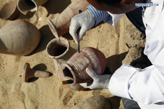 Excavators work at an archeological site of a tomb unearthed by an Egyptian archeological mission working at al-Asassif area on the West Bank of Luxor, Egypt, on Nov. 24, 2018. Egyptian Ministry of Antiquities announced on Saturday the discovery of an ancient tomb in Luxor province in Upper Egypt. (Xinhua/Ahmed Gomaa)