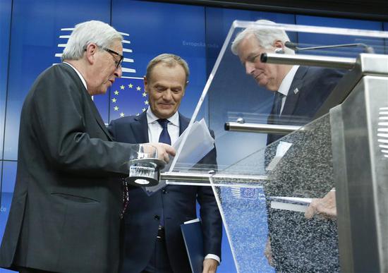 European Commission President Jean-Claude Juncker, President of the European Council Donald Tusk and the European Union's (EU) chief negotiator Michel Barnier (from L to R) talk after a press conference at the end of a special Brexit summit in Brussels, Belgium, Nov. 25, 2018.  (Photo/Xinhua)