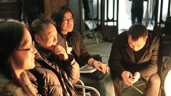 Sun Tao (second from right) and his production team at the filming set of Chopsticks.  (Photo provided to China Daily)