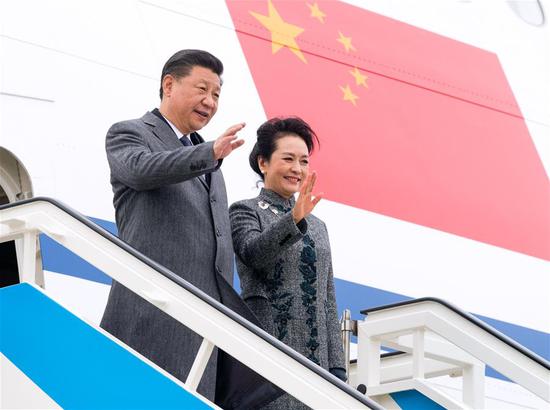 Chinese President Xi Jinping (L) and his wife Peng Liyuan disembark from the airplane after arriving in Lisbon, Portugal, on Dec. 4, 2018. Xi arrived in Portugal on Tuesday for a two-day state visit. (Xinhua/Li Xueren)