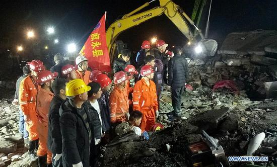 Rescuers search for survivors at the site where a landslide occurred in Fenshui Township in Xuyong County, southwest China's Sichuan Province, Dec. 9, 2018. (Xinhua/Su Zhongguo)