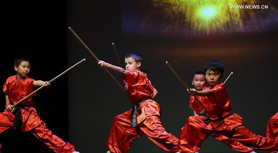 A group of martial arts students perform during 