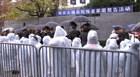 Survivors of the Nanjing Massacre and victims' families attending a memorial before the state memorial on December 13. (Photo/CGTN)