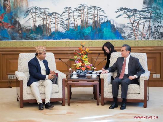 Chinese State Councilor and Foreign Minister Wang Yi (R, front) meets with Nepali Foreign Secretary Shanker Das Bairagi in Beijing, capital of China, Dec. 13, 2018. Shanker Das Bairagi leads a Nepali delegation to attend the 12th meeting of the Joint Consultation Mechanism between the Ministries of Foreign Affairs of Nepal and China. (Xinhua/Zhai Jianlan)