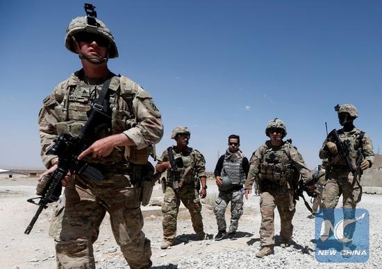FILE PHOTO: U.S. troops patrol at an Afghan National Army (ANA) Base in Logar province, Afghanistan August 7, 2018. (Xinhua/REUTERS)