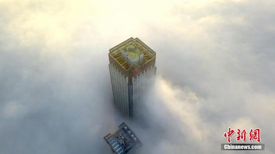 Aerial view of buildings shrouded in fog in Yangzhou, China's Jiangsu 