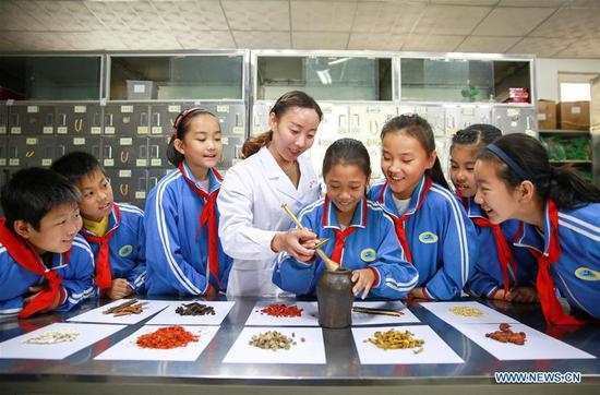 China eyes better primary, secondary education for all-around student development