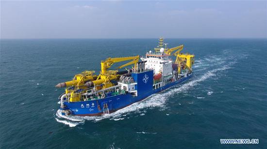Chinese-built dredging vessel Tian Kun Hao is seen sailing on the sea on Jan. 8, 2019. Tian Kun Hao, a Chinese-built dredging vessel, which is the largest of its kind in Asia, returned to the shipyard Wednesday after completing its sea trial of nearly three months. The 140-meter-long, 27.8-meter-wide vessel can dig as deep as 35 meters under the sea floor and dredge 6,000 cubic meters per hour, according to its investor, Tianjin Dredging Co., a subsidiary of China Communication Construction Co. (Xinhua)