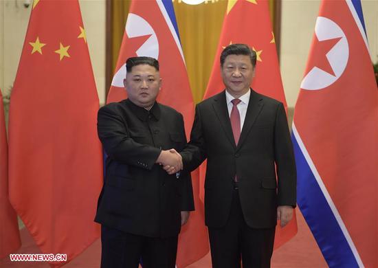 Xi Jinping (R), general secretary of the Central Committee of the Communist Party of China and Chinese president, holds a welcoming ceremony for Kim Jong Un, chairman of the Workers' Party of Korea and chairman of the State Affairs Commission of the Democratic People's Republic of Korea, before their talks at the Great Hall of the People in Beijing, capital of China, Jan. 8, 2019. Xi Jinping on Tuesday held talks with Kim Jong Un, who arrived in Beijing on the same day for a visit to China. (Xinhua/Li Xueren)