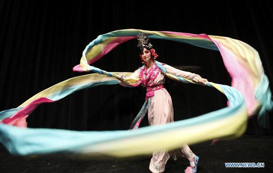 Carrie Feyerabend dances with Shuixiu, literally Water Sleeves, one of the most skillful stunts in Peking Opera, during a rehearsal at Binghamton University (BU) in Binghamton, New York State, the United States, on Nov. 15, 2018. (Xinhua/Wang Ying)
