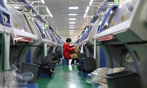 A fully-automated production line at Dongguan Sunrise Knitting in South China's Guangdong on Thursday Province.  (Photo: Chen Qingqing/GT)