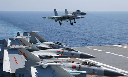 A ship-borne J-15 fighter jet prepares to land at the flight deck of the aircraft carrier Liaoning (Hull 16).  (Photo/eng.chinamil.com.cn)