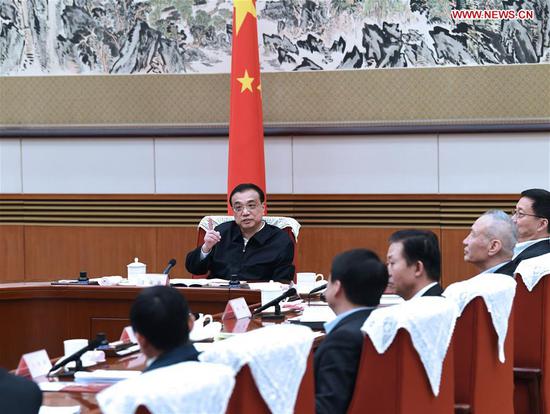 Chinese Premier Li Keqiang, also a member of the Standing Committee of the Political Bureau of the Communist Party of China (CPC) Central Committee, presides over a symposium where he hears views and recommendations made by scholars and entrepreneurs on a draft version of the government work report in Beijing, capital of China, Jan. 15, 2019. Han Zheng, a member of the Standing Committee of the Political Bureau of the CPC Central Committee and vice premier, attended the symposium. (Xinhua/Rao Aimin)