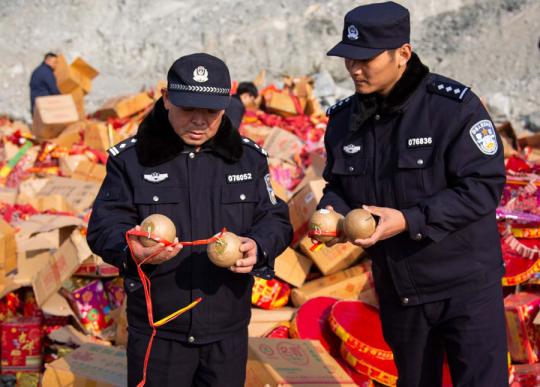 Twenty metric tons of confiscated fireworks valued at 200,000 yuan ($29,600) are readied for destruction in December in Lianyungang, Jiangsu Province. (Photo by SHAO SHIXIN/FOR CHINA DAILY)