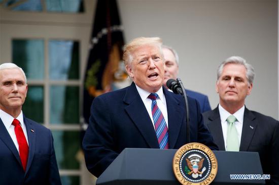 U.S. President Donald Trump (C) speaks during a press conference at the White House Rose Garden in Washington D.C., the United States, on Jan. 4, 2019. Trump said Friday that he's prepared for a partial government shutdown to last for months or years, after his meeting with Congressional leaders yielded no deal on funding for a U.S.-Mexico border wall. (Xinhua/Ting Shen)