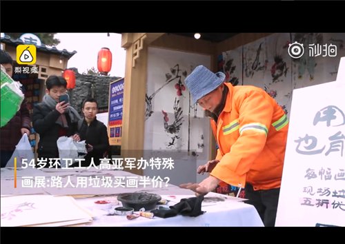 A sanitation worker in Northwest China uses his finger and hand to draw in ink and watercolors to paint traditional images.