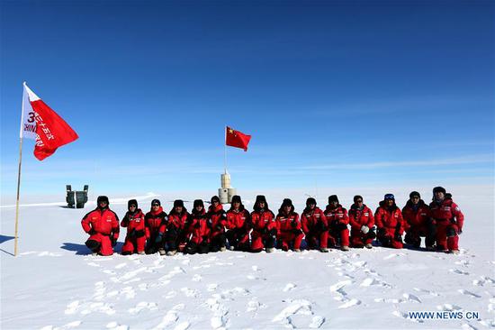 Members of China's 35th Antarctic expedition team pose for a group photo at the area of the Dome Argus (Dome A), the peak of Antarctica's inland icecap, in Antarctica, Jan 16, 2019. (Photo/Xinhua)