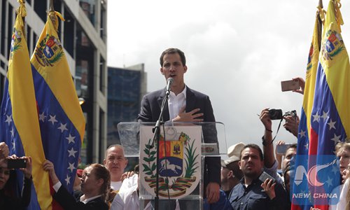 Juan Guaido (C), head of the opposition-controlled National Assembly, delivers a speech at the Francisco de Miranda avenue, in Caracas, Venezuela, on January 23. (Photo/Xinhua)