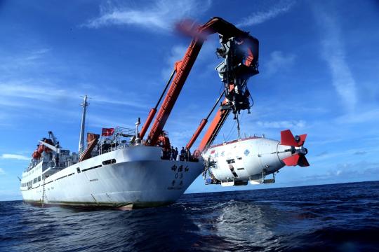 Jiaolong, China's manned submersible, is lowered for a dive on June 13, 2017. (Photo/Xinhua)