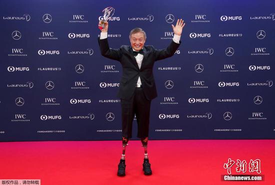 China's Xia Boyu, a double amputee who climbed Mount Everest, winner of the Laureus Sporting Moment of the Year celebrates at the 2019 Laureus World Sports Awards, Monday, Feb. 18, 2019.  (Photo/Agencies)