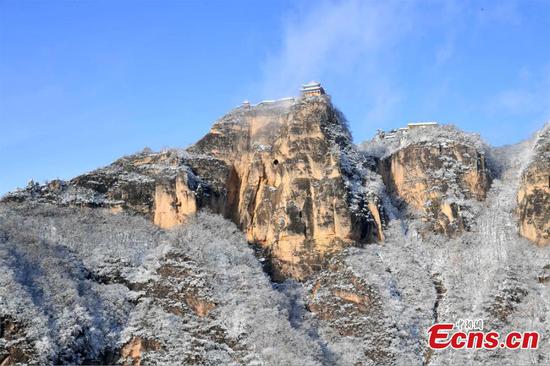 Snow-covered Taoism mountain reveals special charm