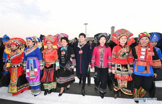 Deputies to the 13th National People's Congress (NPC) walk to the Great Hall of the People for the opening meeting of the first session of the 13th NPC in Beijing, capital of China, March 5, 2018.  (Xinhua/Yang Zongyou)