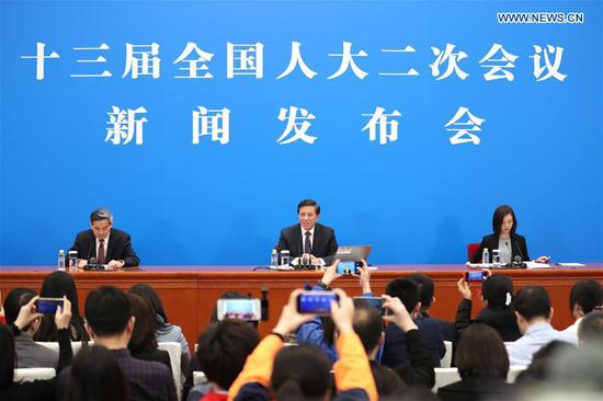 Zhang Yesui (C), spokesperson for the second session of the 13th National People's Congress (NPC), speaks during a press conference on the agenda of the session and the work of the NPC at the Great Hall of the People in Beijing, capital of China, March 4, 2019. (Xinhua/Jin Liwang)