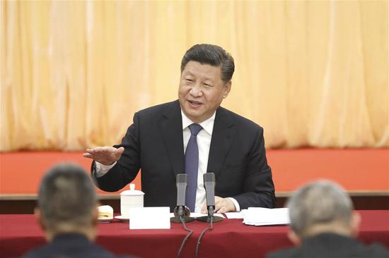 Chinese President Xi Jinping, also general secretary of the Communist Party of China (CPC) Central Committee and chairman of the Central Military Commission, visits political advisors from the sectors of culture and art, and social sciences who are attending the second session of the 13th National Committee of the Chinese People's Political Consultative Conference (CPPCC) in Beijing, capital of China, March 4, 2019. Xi joined them in a joint panel discussion and heard their opinions and suggestions. Wang Yang, a member of the Standing Committee of the Political Bureau of the CPC Central Committee and chairman of the CPPCC National Committee, also attended the discussion. (Xinhua/Sheng Jiapeng)