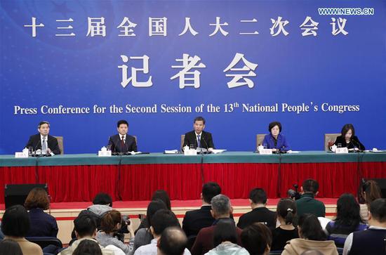 China's Minister of Finance Liu Kun (C), and vice ministers Cheng Lihua (2nd R) and Liu Wei (2nd L) attend a press conference on the country's fiscal and tax reforms and fiscal work for the second session of the 13th National People's Congress in Beijing, capital of China, March 7, 2019. (Xinhua/Shen Bohan)