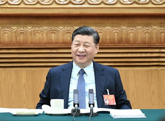 Chinese President Xi Jinping, also general secretary of the Communist Party of China (CPC) Central Committee and chairman of the Central Military Commission, joins deliberation with deputies from central China's Henan Province at the second session of the 13th National People's Congress in Beijing, capital of China, March 8, 2019. (Xinhua/Xie Huanchi)