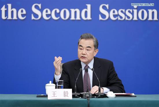 Chinese State Councilor and Foreign Minister Wang Yi answers questions at a press conference on China's foreign policy and relations on the sidelines of the second session of the 13th National People's Congress in Beijing, capital of China, March 8, 2019. (Xinhua/Shen Bohan)