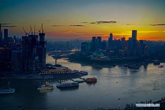 Photo taken on May 3, 2017 shows the Chaotianmen wharf in southwest China's Chongqing Municipality. The Yangtze, the world's third-longest river, runs through nine Chinese provinces and two municipalities, covering 2.05 million square km. The Yangtze River Economic Belt, which accounts for more than 40 percent of both the national population and GDP, is a new growth engine for the country, reducing the development gap between east, central and western regions. (Xinhua/Liu Chan)