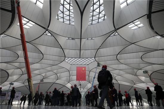 Chinese and foreign media journalists visit Beijing Daxing International Airport on March 1. [Photo by Wang Zhuangfei / China Daily] 