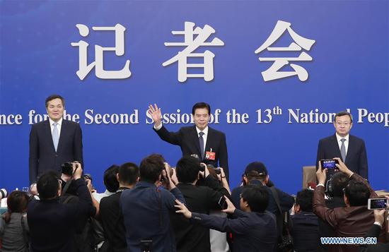 China's Minister of Commerce Zhong Shan (C), Vice Minister of Commerce and Deputy China International Trade Representative Wang Shouwen (R) and Vice Minister of Commerce Qian Keming attend a press conference on China's domestic market and all-round opening-up for the second session of the 13th National People's Congress (NPC) in Beijing, capital of China, March 9, 2019. (Xinhua/Shen Bohan)