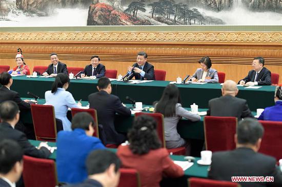 Chinese President Xi Jinping, also general secretary of the Communist Party of China Central Committee and chairman of the Central Military Commission, joins deliberation with deputies from Fujian Province at the second session of the 13th National People's Congress in Beijing, capital of China, March 10, 2019. (Xinhua/Li Xueren)