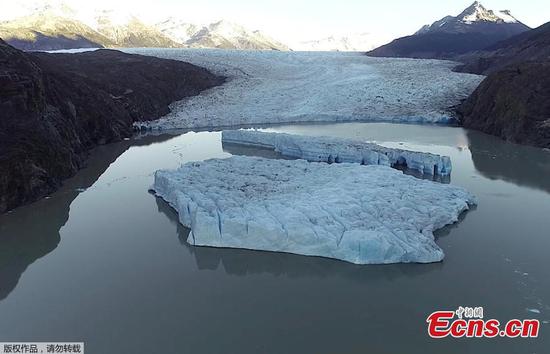 Two new icebergs break off from the Grey glacier in Chile