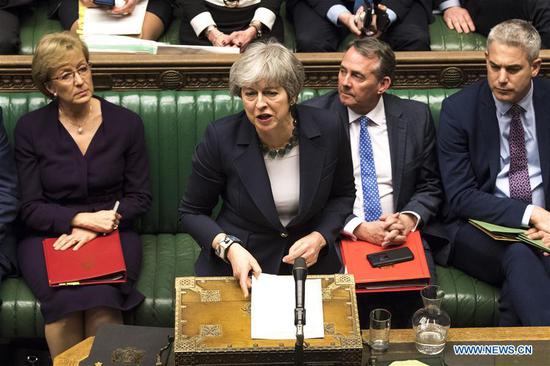 British Prime Minister Theresa May (Front) speaks during the no-deal Brexit vote in the House of Commons in London, Britain, on March 13, 2019. British MPs on Wednesday voted to reject no-deal Brexit at any time in the wake of Tuesday night's shattering defeat of the Brexit deal of British Prime Minister Theresa May. (Xinhua/UK Parliament/Mark Duffy) HOC MANDATORY CREDIT: UK Parliament/Mark Duffy