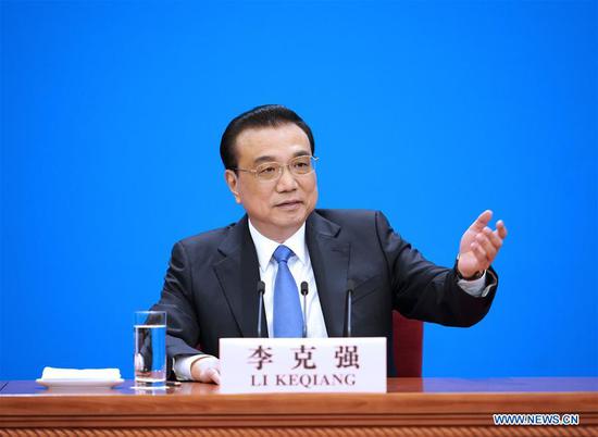 Chinese Premier Li Keqiang meets the press after the conclusion of the second session of the 13th National People's Congress (NPC) at the Great Hall of the People in Beijing, capital of China, March 15, 2019. (Xinhua/Xing Guangli)