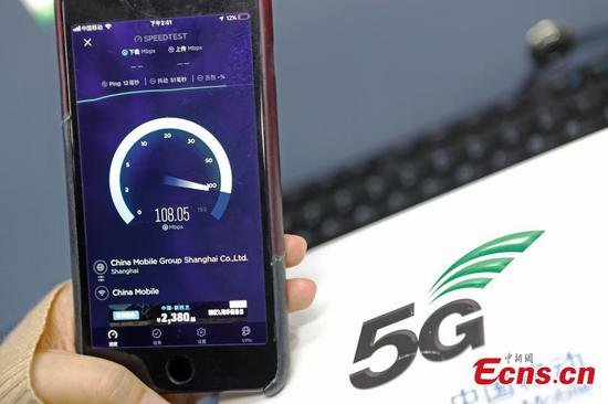 A passenger tests the 5G network and services in the Shanghai Hongqiao Railway Station, Feb. 18, 2019. The railway station, one of the world's busiest, will become the world's first 