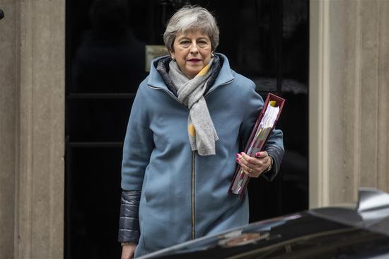 British Prime Minister Theresa May leaves 10 Downing Street for the Prime Minister's Questions in the House of Commons in London, Britain, March 20, 2019. (Xinhua/Ray Tang)