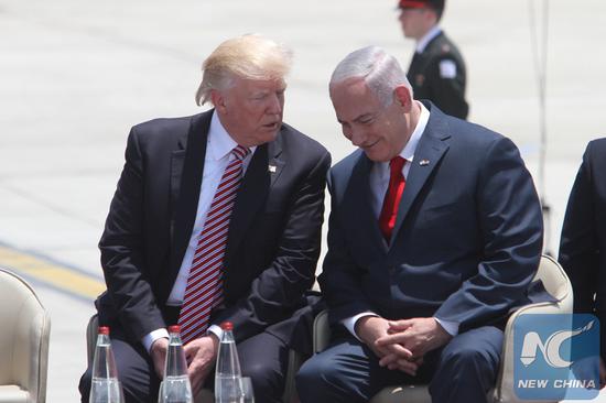 File Photo: U.S. President Donald Trump (L) speaks with Israeli Prime Minister Benjamin Netanyahu at Ben Gurion International Airport in Tel Aviv, Israel, on May 22, 2017. (Xinhua/Gil Cohen Magen)