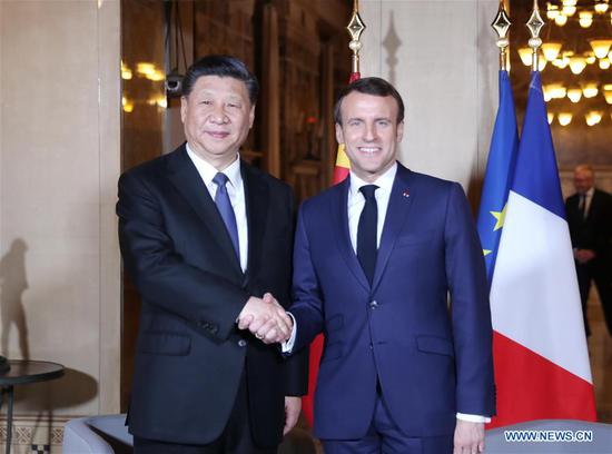 Xi meets Macron on maintaining sound China-France ties