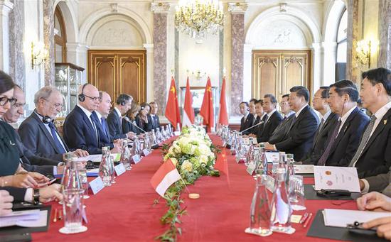 Xi holds talks with Prince Albert II