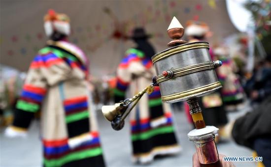 People attend an event to celebrate the 60th anniversary of democratic reforms in Tibet, at a community in Lhasa, capital of southwest China's Tibet Autonomous Region, March 23, 2019. (Xinhua/Chogo)