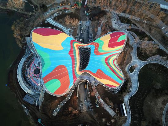 The multicolored Guirui Theater, shaped like a butterfly, is expected to be completed in early April. It will be used for the opening and closing ceremonies of the upcoming horticulture expo. (Photo/Xinhua)