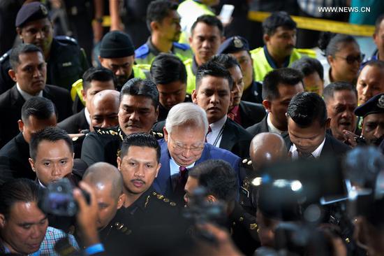 File Photo: Former Malaysian Prime Minister Najib Razak (C) arrives at a court in Kuala Lumpur, Malaysia, on July 4, 2018. (Xinhua/Chong Voon Chung)