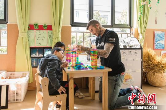 UNICEF Goodwill Ambassador David Beckham plays with children during a visit to Xianghuaqiao Kindergarten in Shanghai, China, March 27, 2019. (Photo provided by UNICEF)