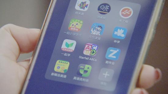 Parents need to install several study apps on the smartphone of their child, some of which are required by schools. (CGTN Photo)