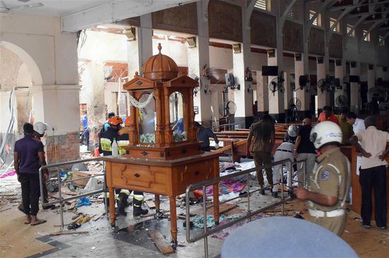 People work at a blast scene at St. Anthony's Church in Kochchikade in Colombo, Sri Lanka, April 21, 2019.  (Xinhua)